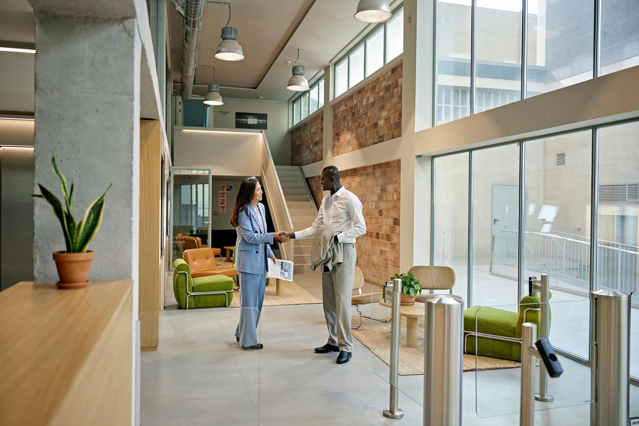 Real estate agent greeting a client before a property showing