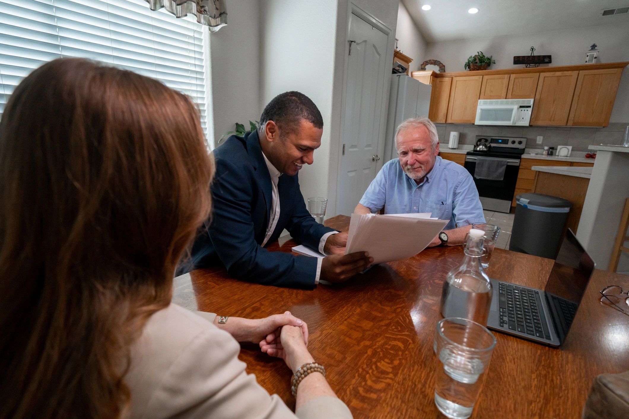 Advisor meeting with clients to discuss mortgage and financing options