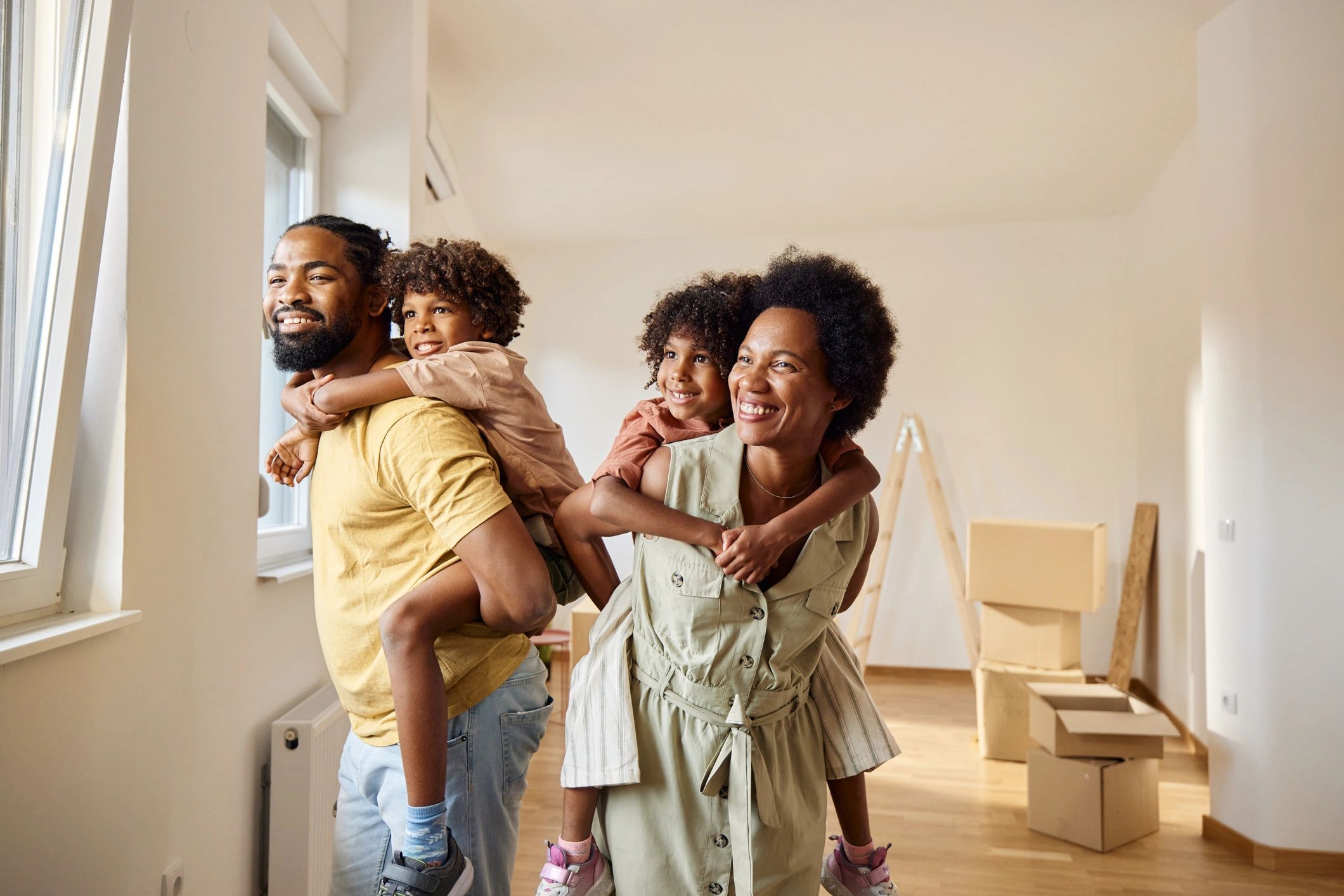 Happy homeowners celebrating in their new home