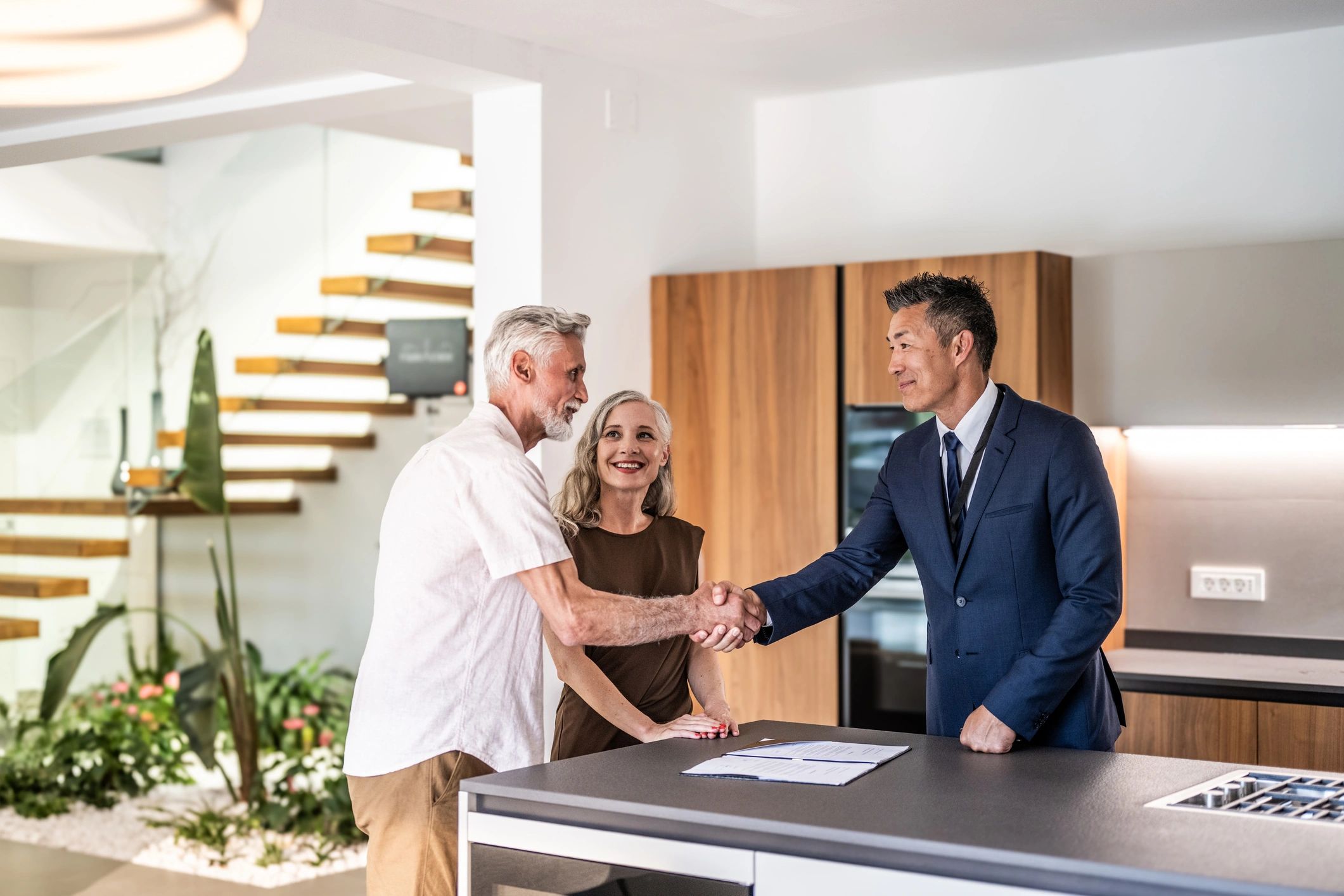 Real estate agent consulting with clients
