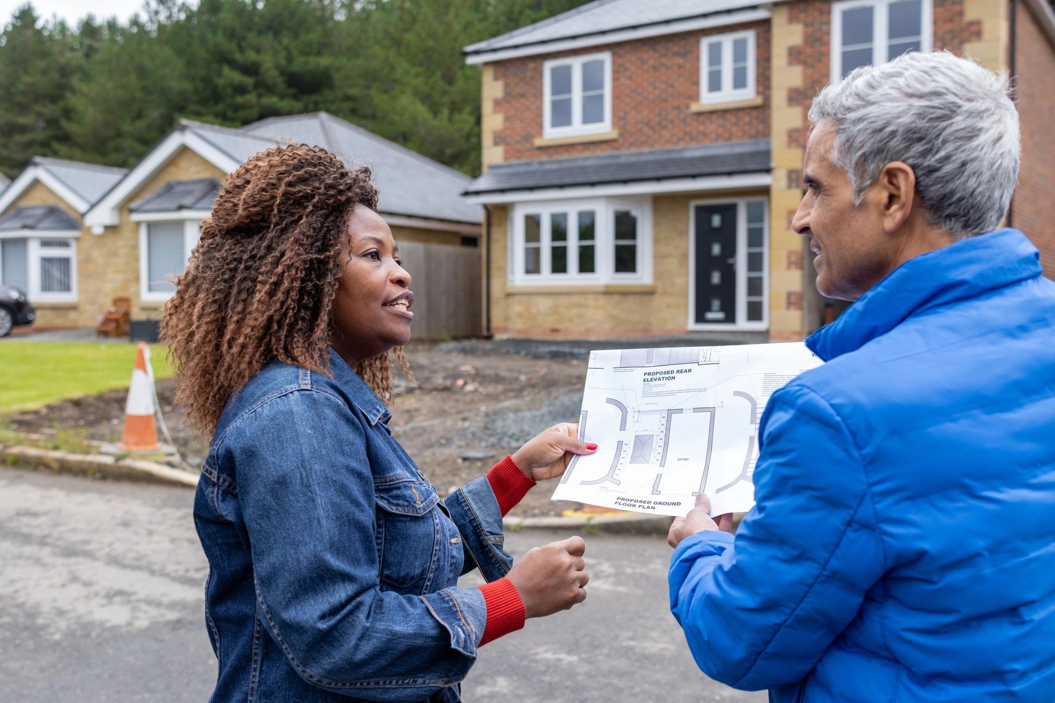 Agent discussing property plans with a client